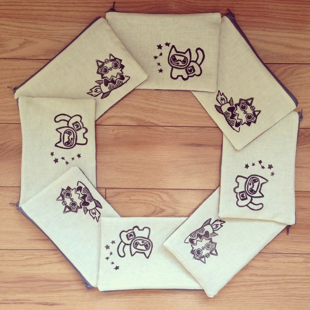 Cats in Space pouches arranged in the shape of a STOP sign.