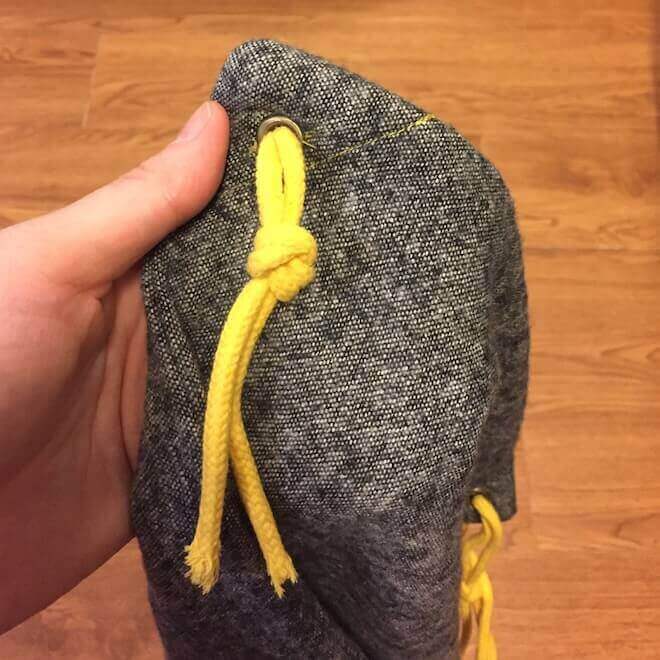 force both ends through the grommet and tie off