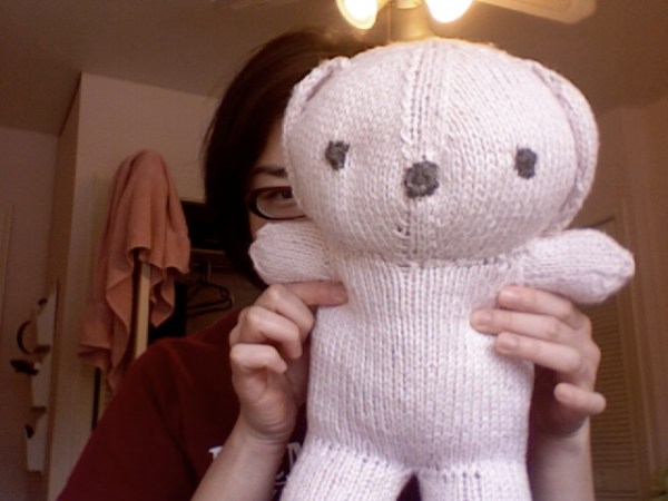 an emaciated pale pink bear 